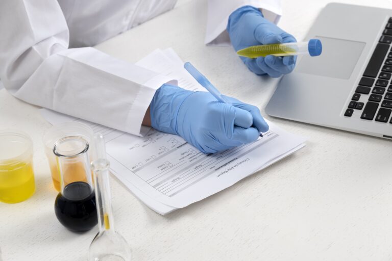 A doctor discussing a health form with a patient in a clinic setting.